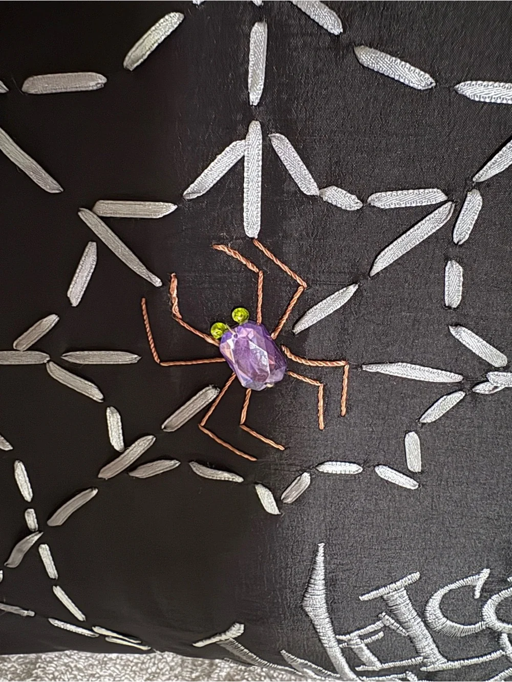Ribbon spider web  pillow with jeweled spider & stitched “Welcome To Our Web”